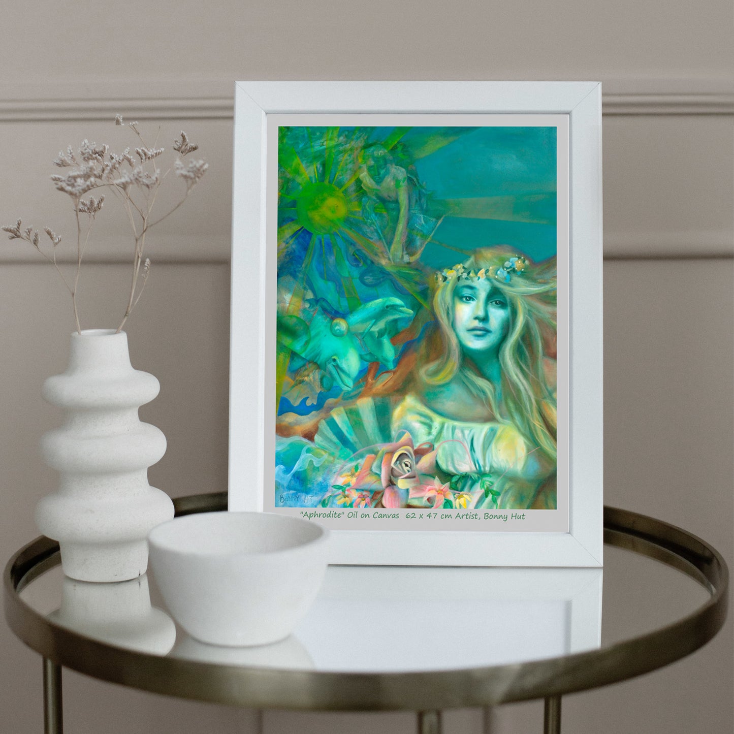Aphrodite art wall print, Greek Mythology, Spring Goddess of love, Valentines day gift, The birth of Venus on a seashell with her dolphins and her son cupid. Print is reproduced from a hand-painted oil painting in shades of green. Framed on table.