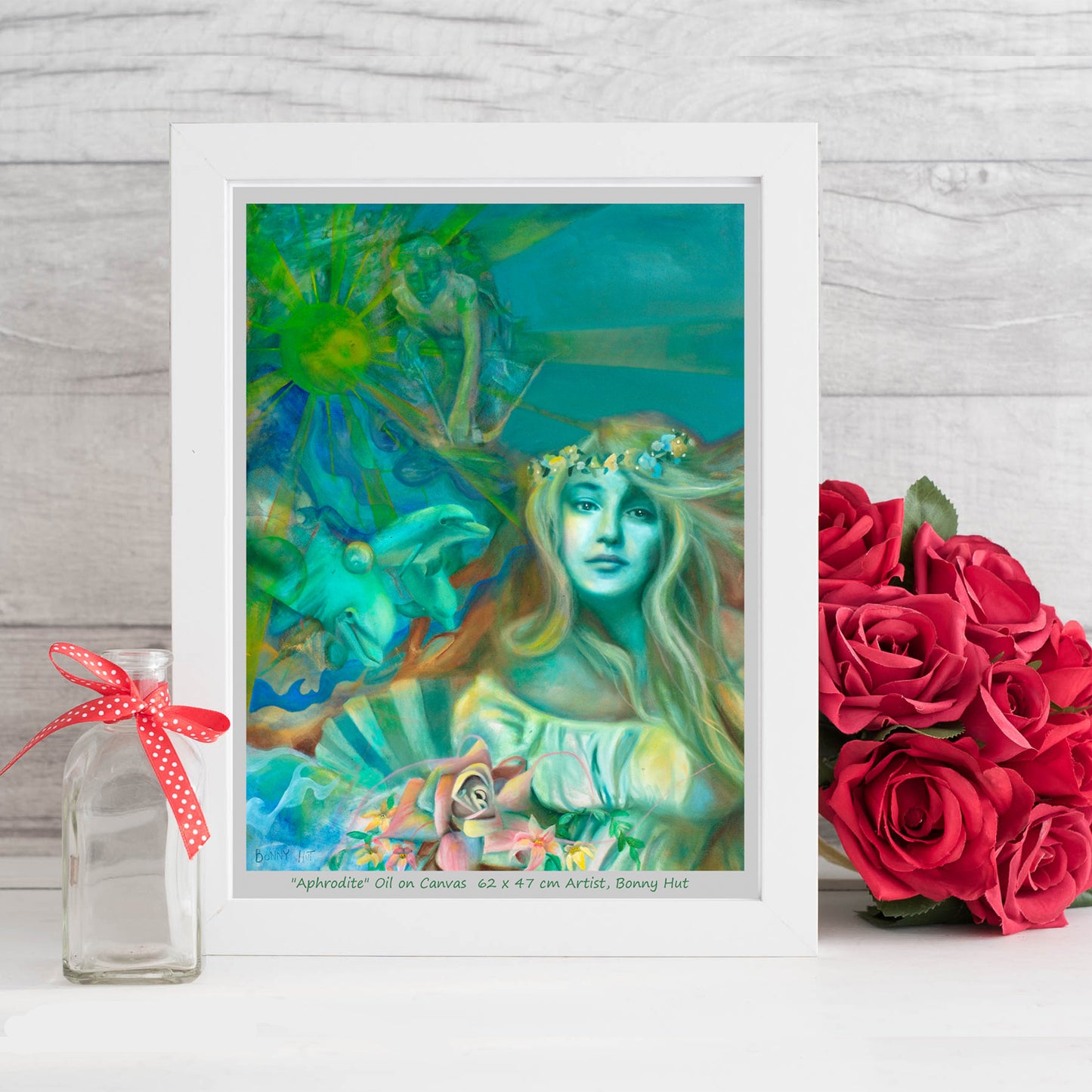 Aphrodite art wall print, Greek Mythology, Spring Goddess of love, Valentines day gift, The birth of Venus on a seashell with her dolphins and her son cupid. Print is reproduced from a hand-painted oil painting in shades of green. Framed in a white frame.
