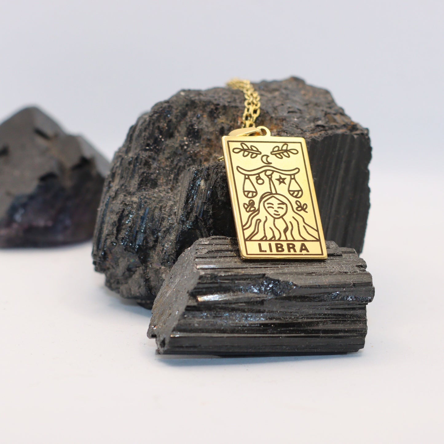 Libra birthday gift necklace-pendant, Zodiac star-sign jewellery for Astrology lovers. Shown here with a watercolor border. Displayed here with crystal rocks.