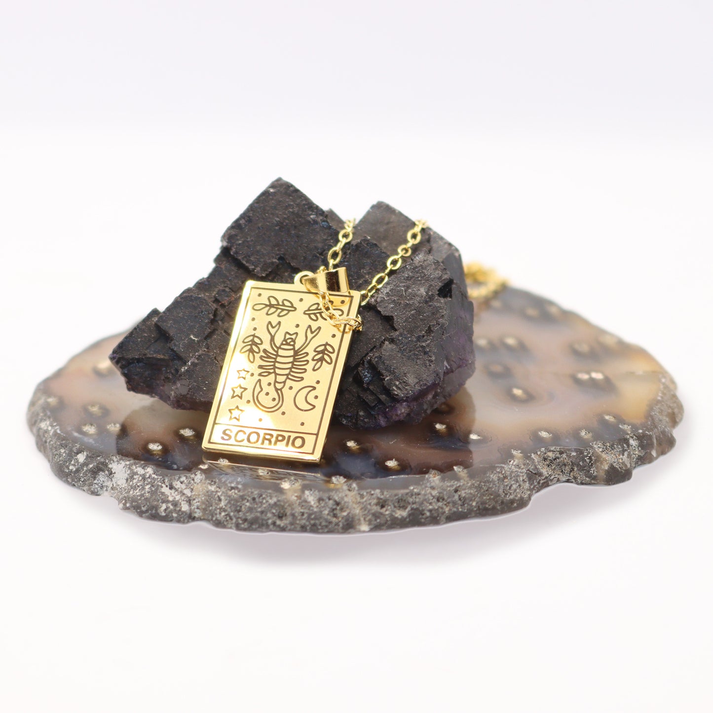 Scorpio birthday gift necklace-pendant, Zodiac star-sign jewellery for horoscope astrology lovers. Spiritual esoteric gifts for her. Displayed with crystal rocks.
