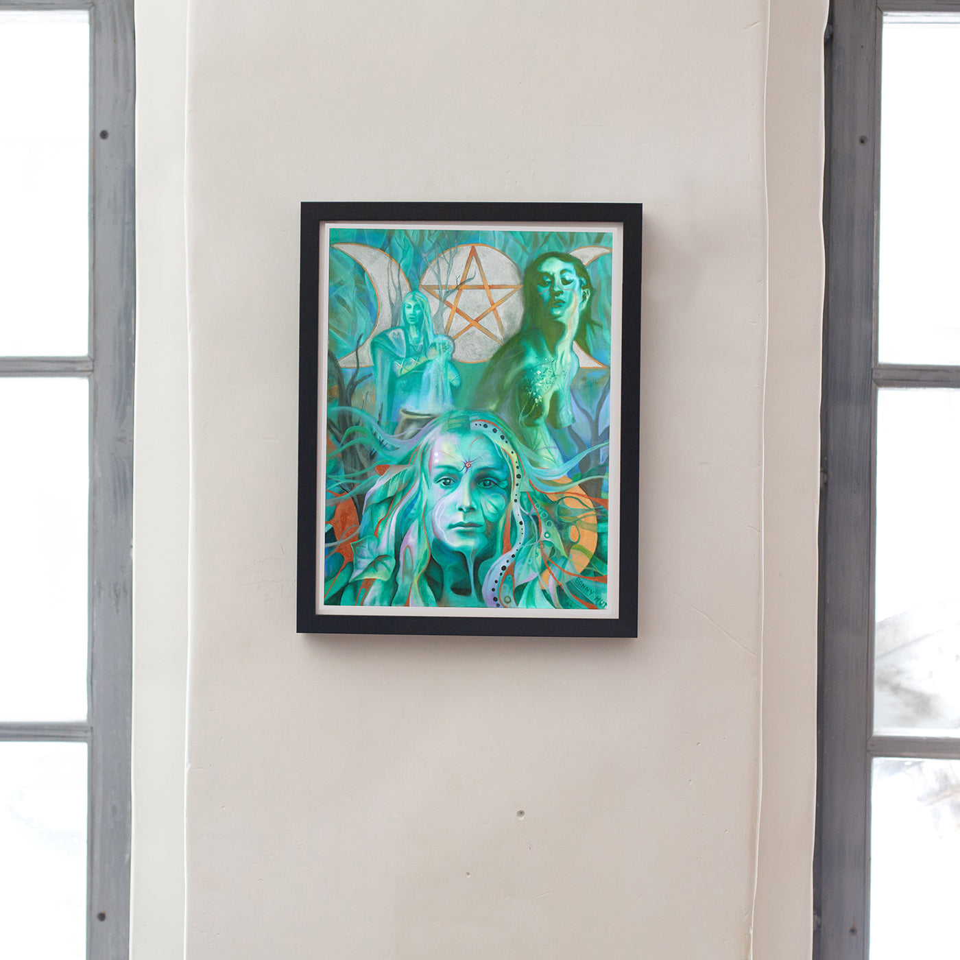 The Triple Goddess art wall print in shades of green. Wiccan-Pagan Mythology Maiden Mother and Crone. from portrait oil painting, arty Witchy gifts from our metaphysical store. Framed on the wall.