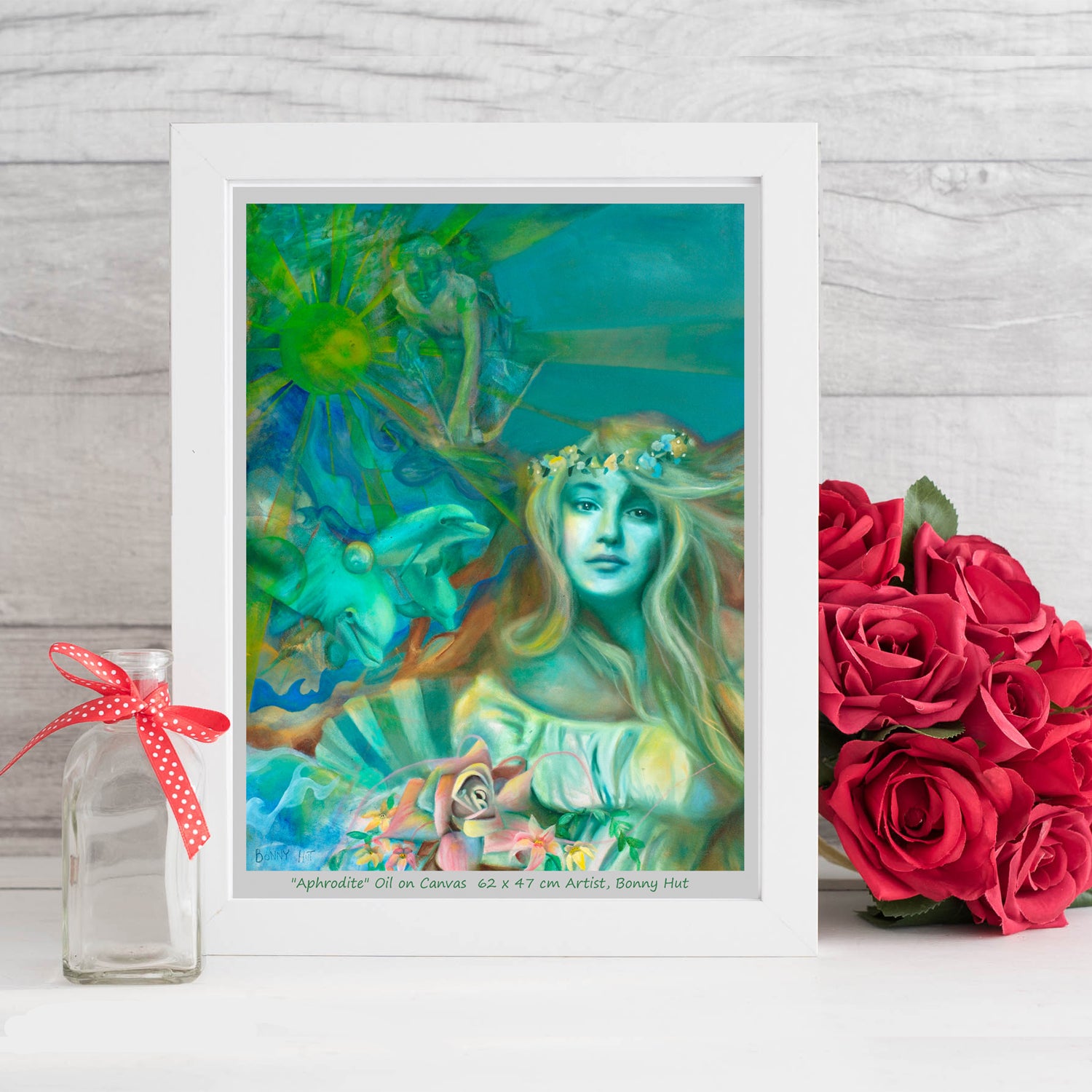 Aphrodite art wall print, Greek Mythology, Spring Goddess of love, Valentines day gift, The birth of Venus on a seashell with her dolphins and her son cupid. Print is reproduced from a hand-painted oil painting in shades of green. Framed in a white frame. 