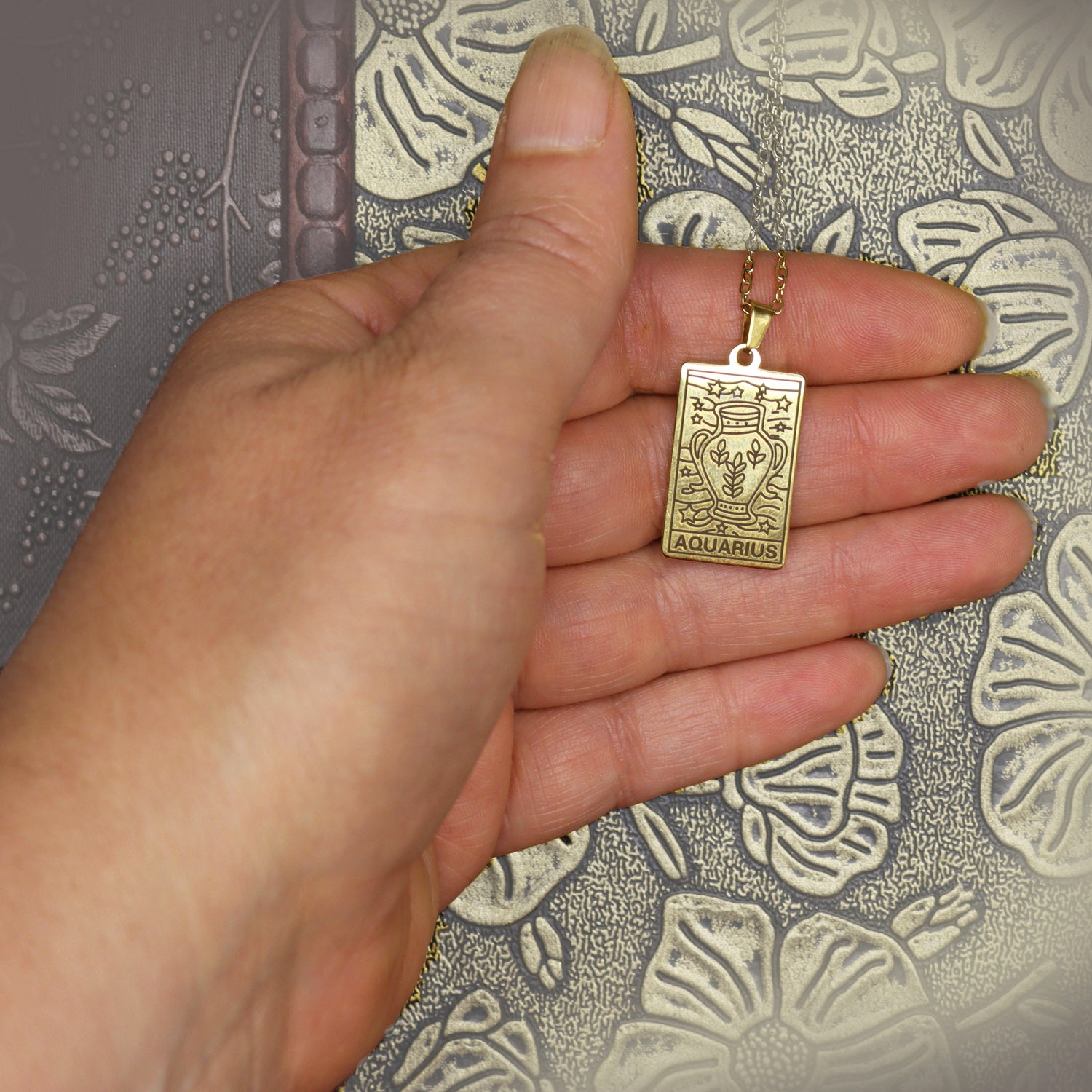 Aquarius birthday gift necklace-pendant, Zodiac star-sign jewellery gifts from our Melbourne Metaphysical store. Unique astrological celestial, esoteric, spiritual gift for the Aquarian in your life.  Necklace is shown in hand