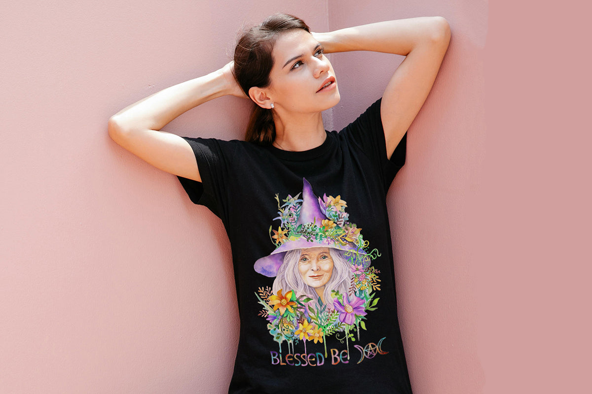 Woman wearing a black t-shirt with a colorful graphic design of a witches portrait against a pink background.

Downloadable, printable clip art reproduced from a hand-painted wiccan / pagan watercolor painting. An instant-access digital product.