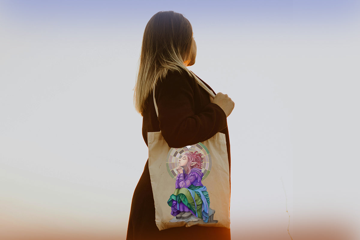 Person holding a tote bag with floral design against a blurred background. There is an illustration of a spiritual pixie magical creature on the bag. 

Downloadable, printable wall art reproduced from a hand-painted  gouache painting. Instant access digital product. Great gifts for her.
