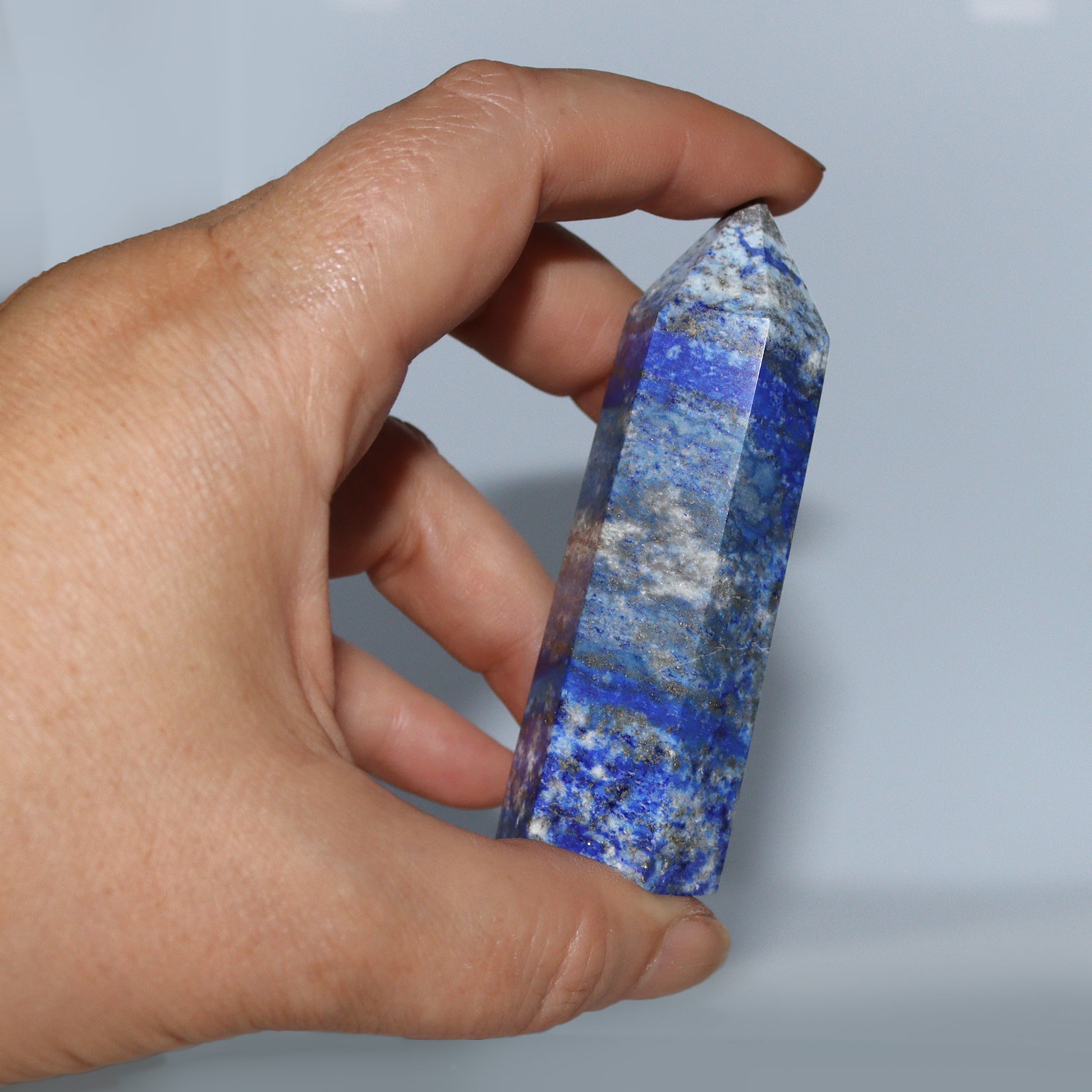 Blue and gold Lapis Lazuli Crystal Hexagonal Tower / Obelisk. Esoteric spiritual gifts from our New age Metaphysical store.