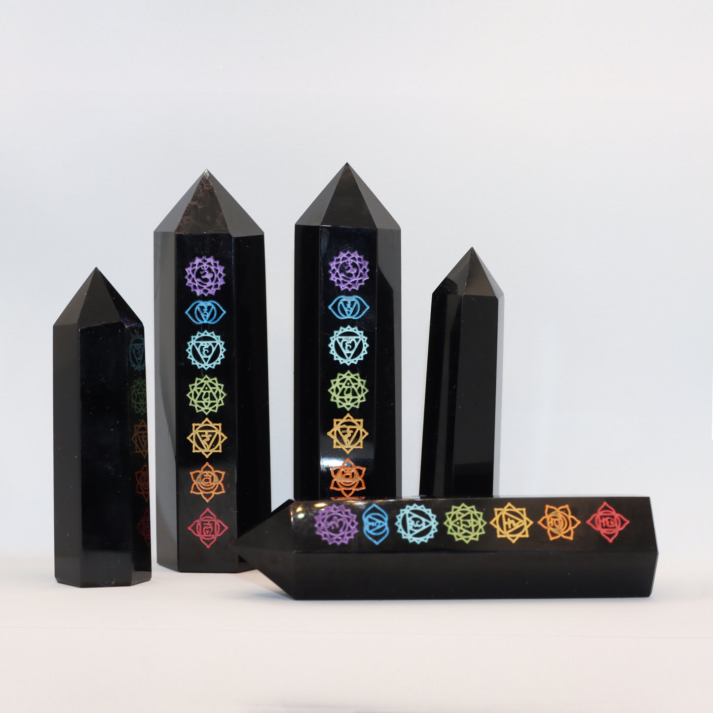 Natural Black Obsidian Crystal towers - generators - obelisks - with chakra design for sale.
Esoteric Spiritual gifts from our online Metaphysical store. Sent from Melbourne, Australia. Free postage.