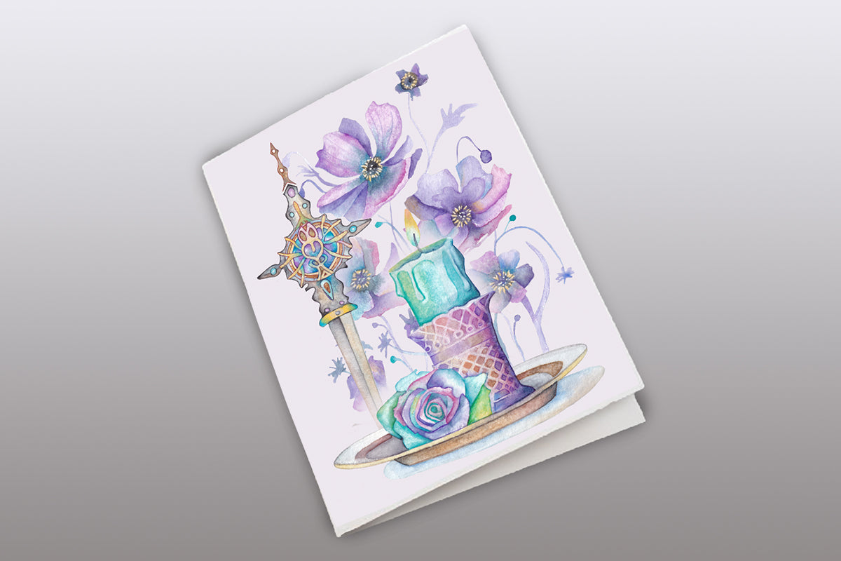 Greeting card with colorful illustration of a sword, flowers, and a cake on a gray background.  Wiccan, pagan clipart instant download from hand-painted watercolor paintings. Great for journals pagan products, book of shadows and creating your own witch gifts. 